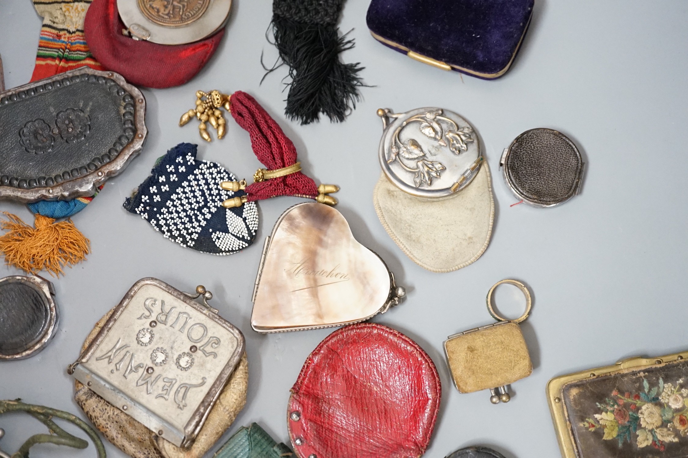 Mixed collection of mainly 19th century leather purses of various sizes and shapes, including two novelty ‘owl’ purses, a horse shoe shaped silver framed purse, cut steel purses, approx 39 in total